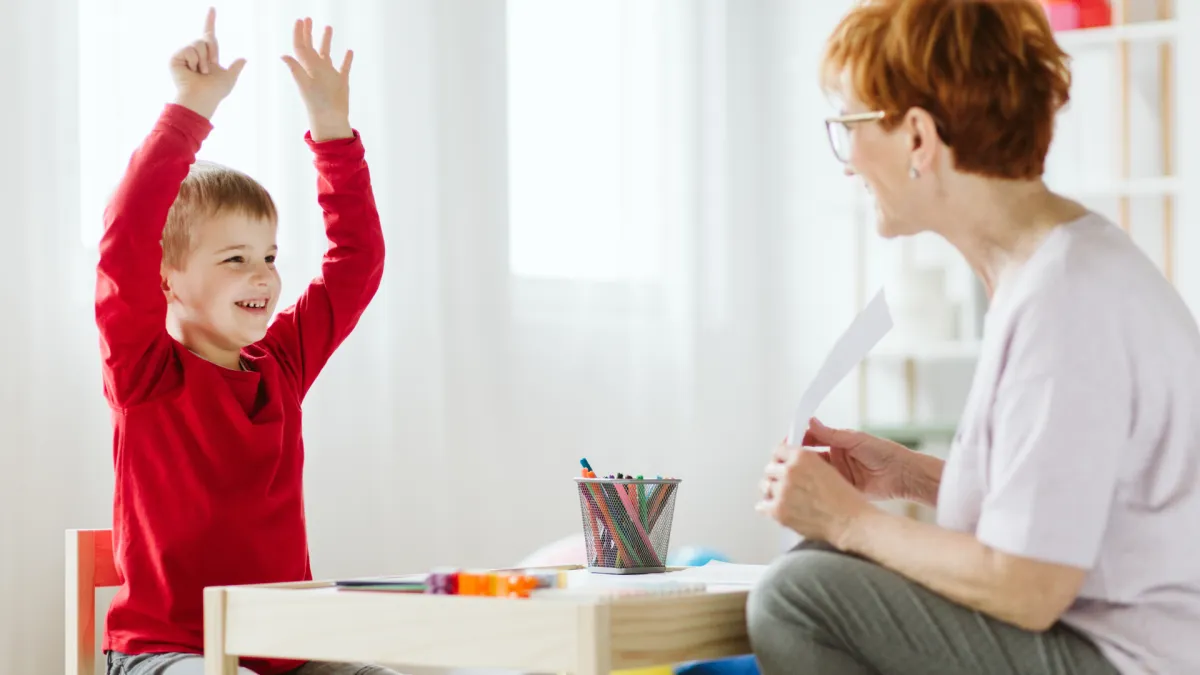 woman placing sticky notes on wall