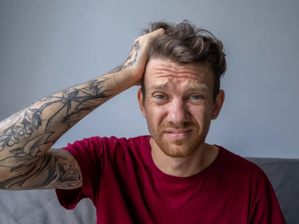 woman placing sticky notes on wall