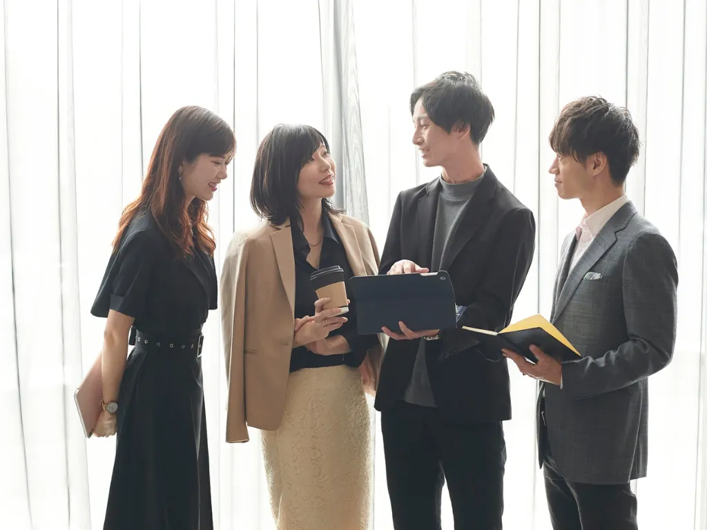 woman placing sticky notes on wall