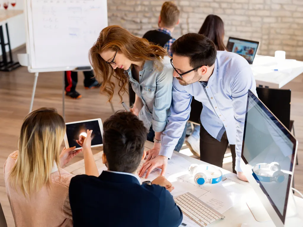 woman placing sticky notes on wall