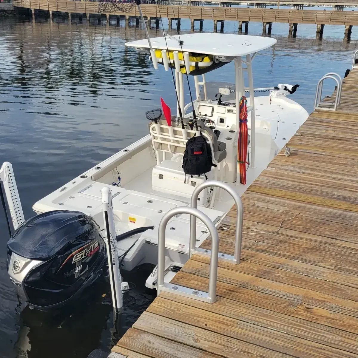 white and blue boats on sea during daytime