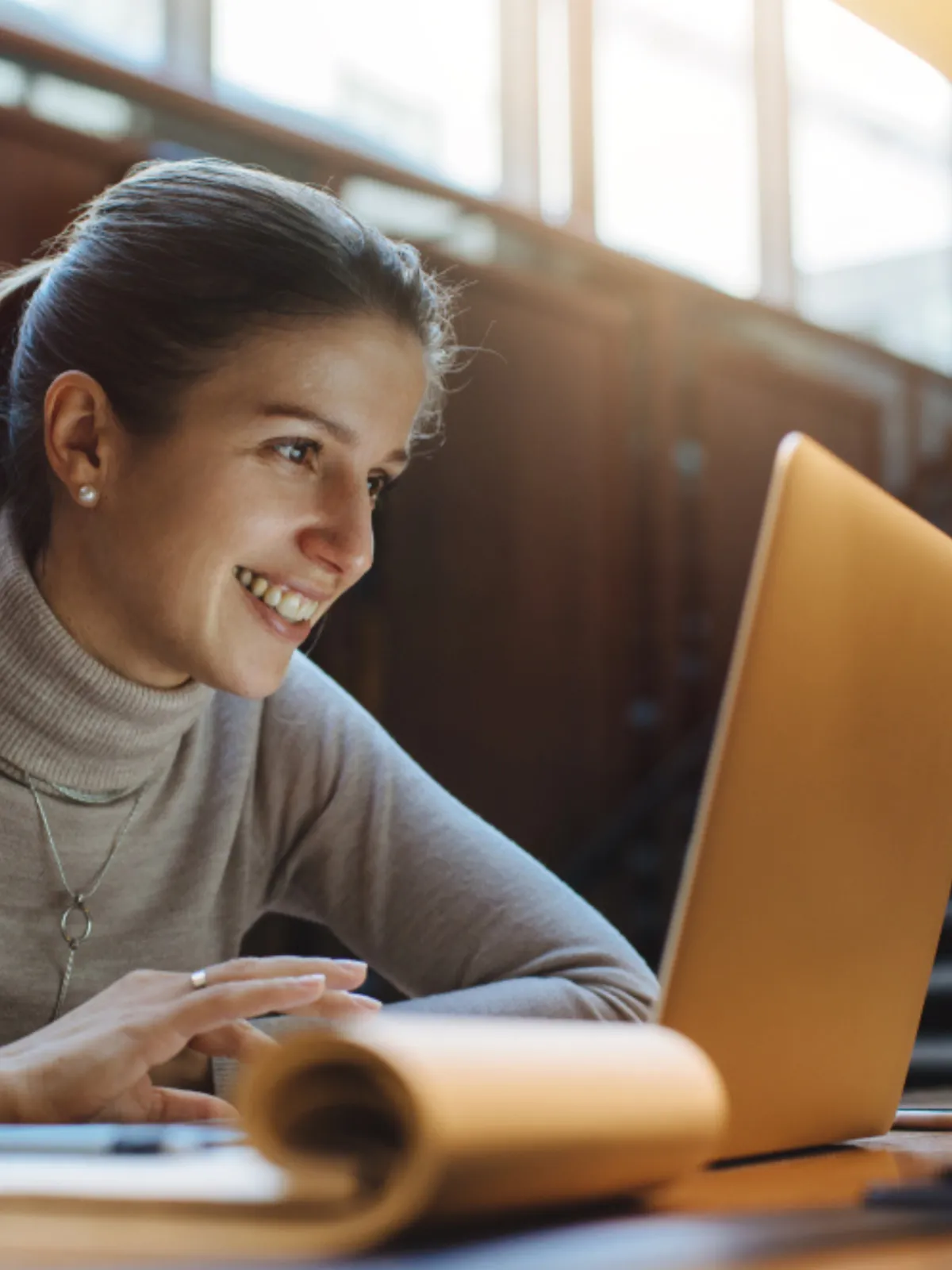  Aspiring female entrepreneur taking an online course on her laptop