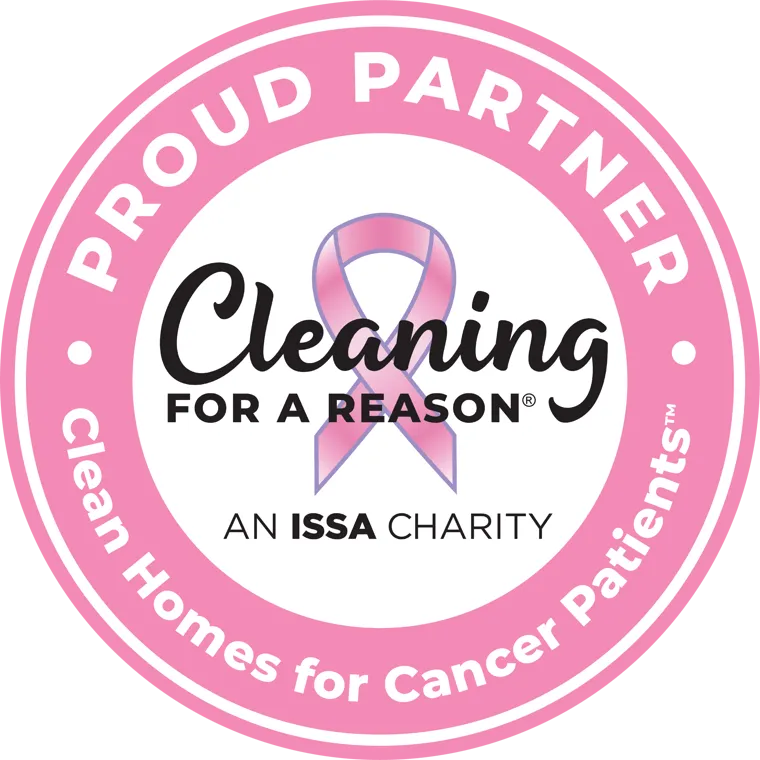 A circular badge for **Cleaning for a Reason**, an ISSA Charity. The design features a pink ribbon in the center, symbolizing breast cancer awareness, and the text "Cleaning for a Reason" in elegant black font. The outer pink ring includes the words **"Proud Partner"** and **"Clean Homes for Cancer Patients™"**, highlighting the organization's mission to provide free cleaning services for cancer patients.