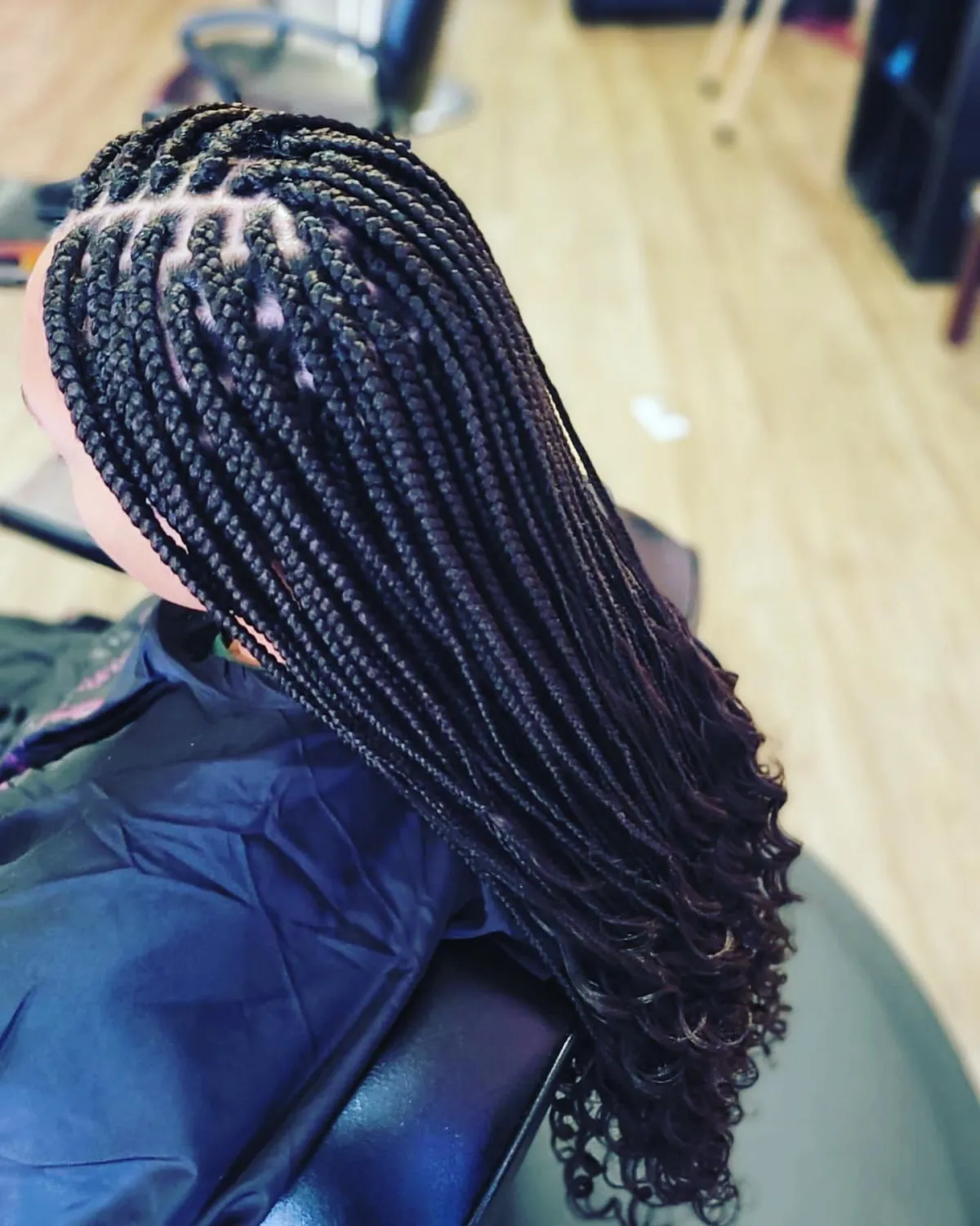 Intricate box braids by the skilled stylists at Mary Braids, Omaha's finest hair braiding salon, symbolizing cultural pride and fashion.