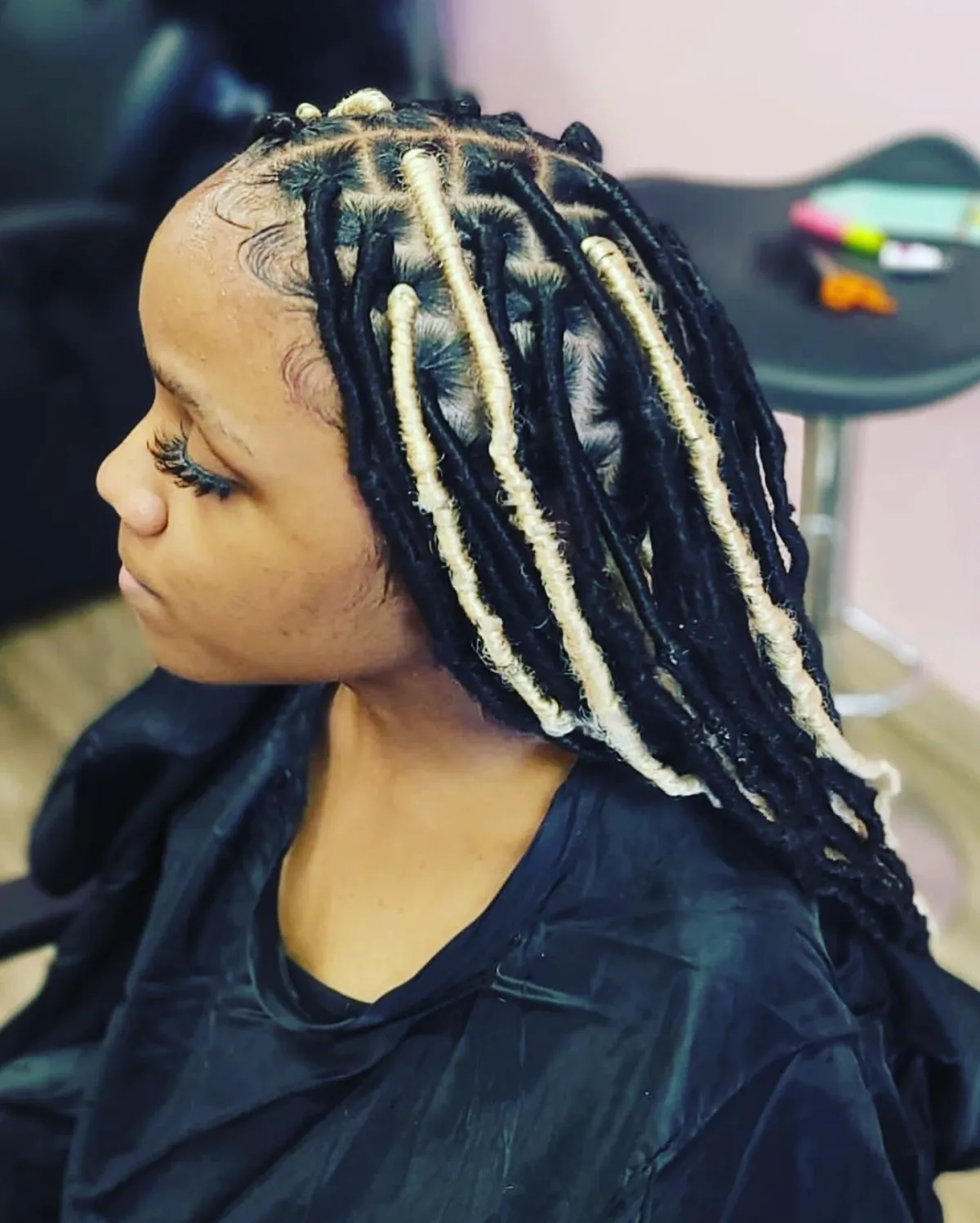 Client with beautifully crafted dreadlocks at Mary Braids, the African hair braiding specialists in Omaha.