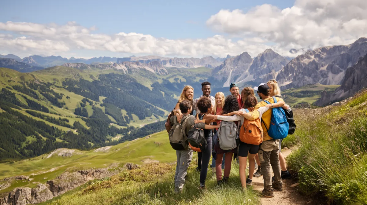 a person walking on a beach next to the ocean