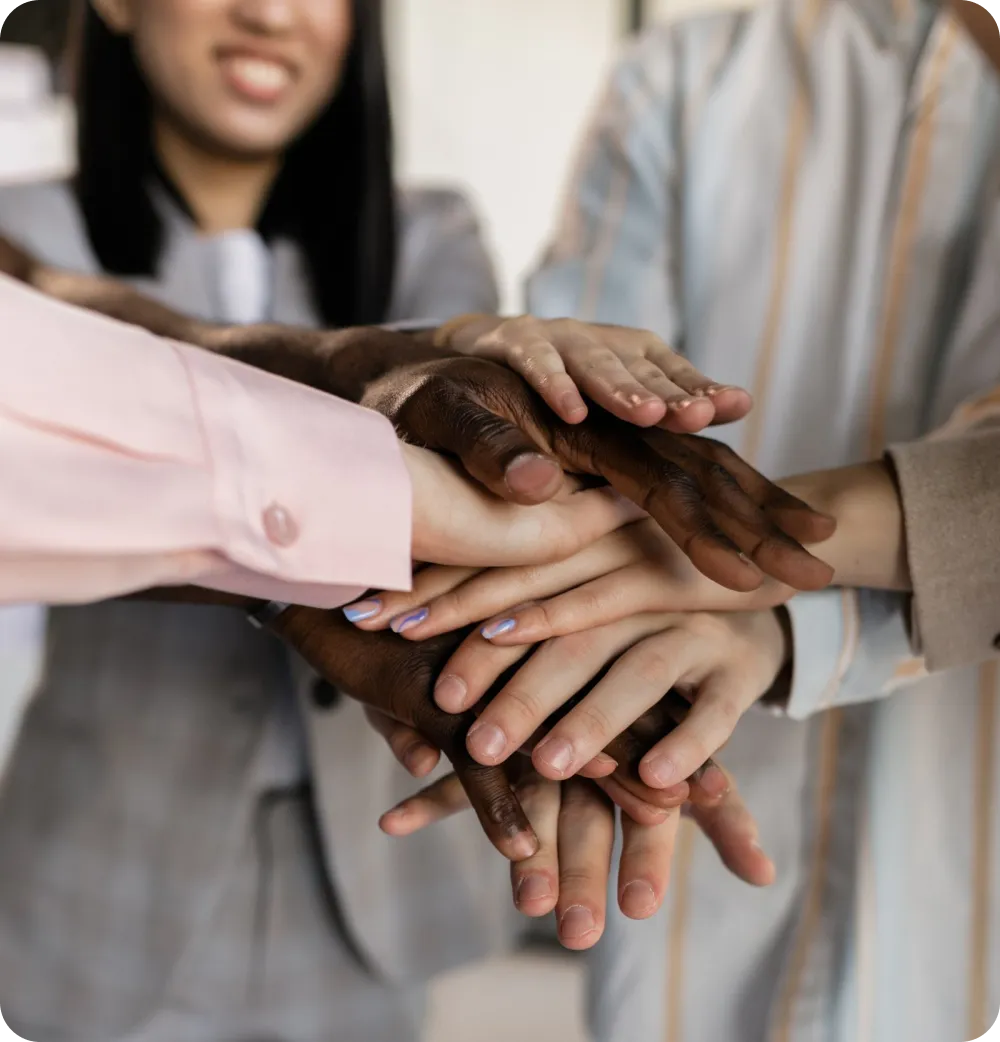 Stack of hands symbolizing teamwork
