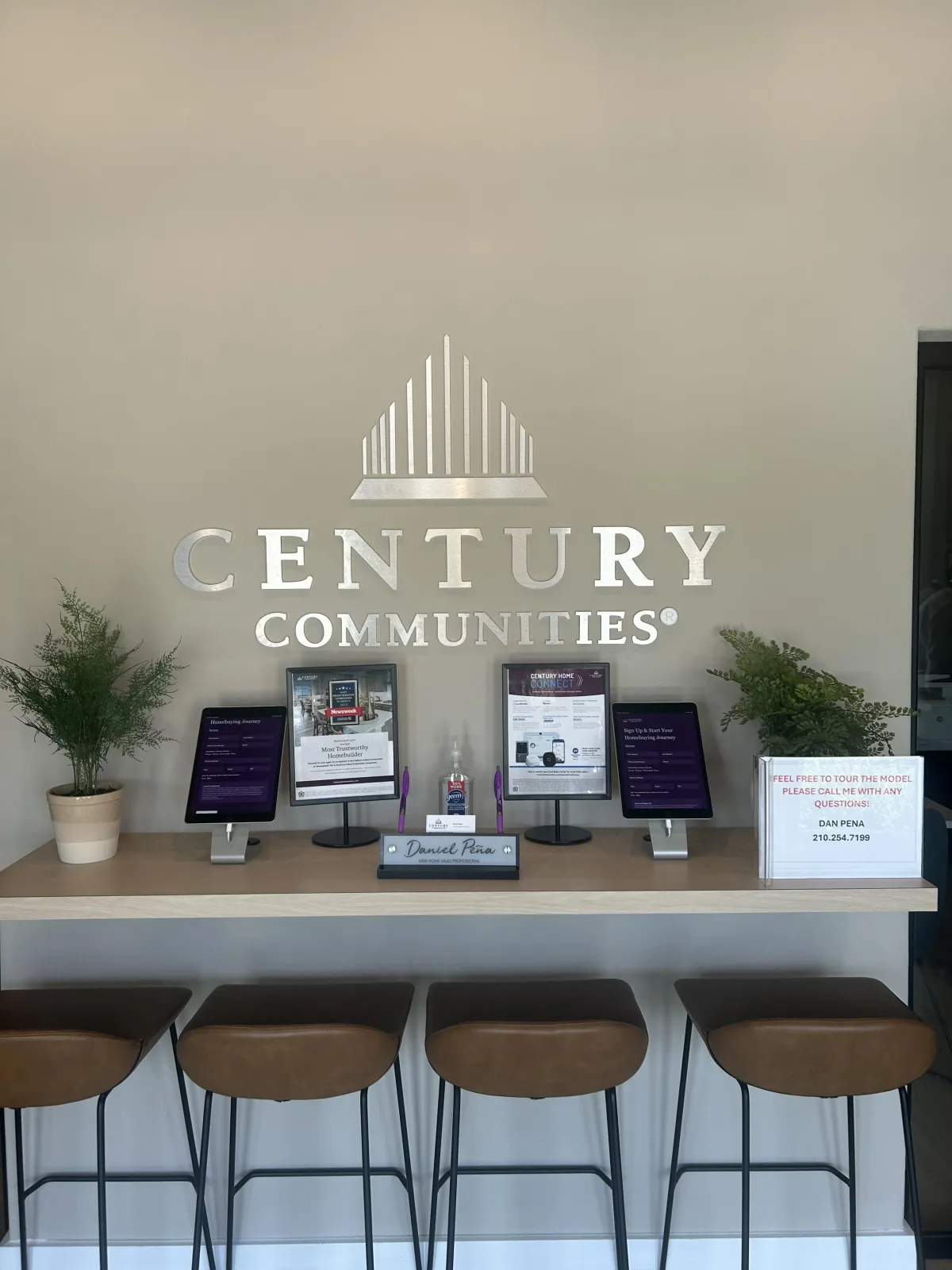 a dining room table with chairs and a vase of flowers