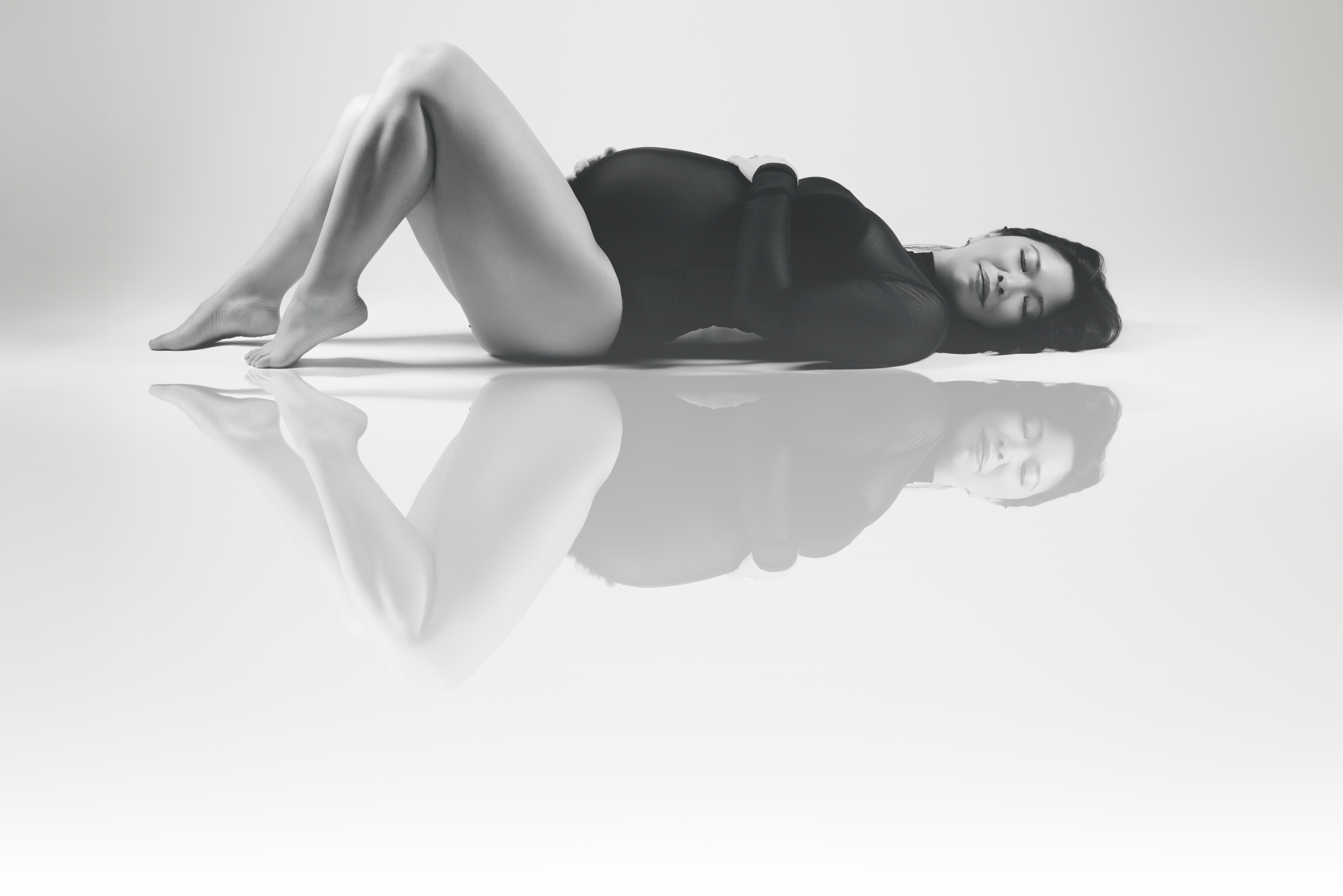 maternity fashion inspire photo with woman laying down