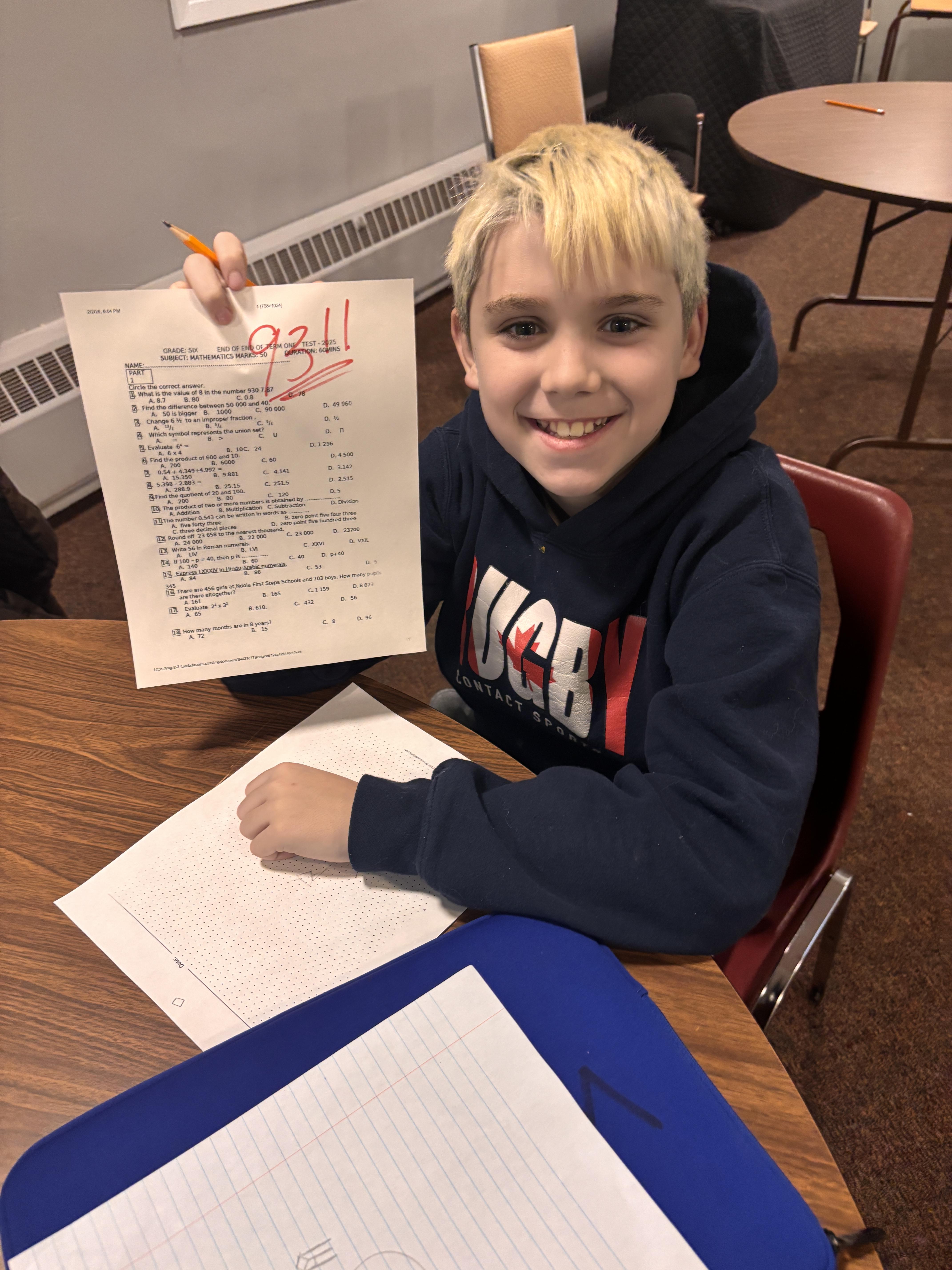 People raising hands towards a man holding a skateboard