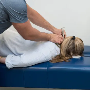 Dr. Josh providing chiropractic adjustment in Suwanee, GA.