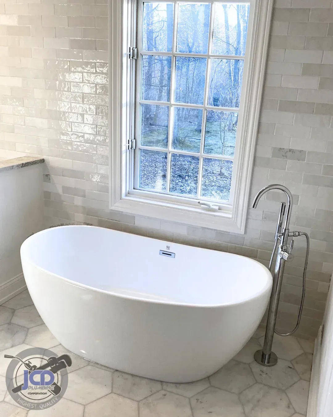 Freestanding bathtub plumbing installation completed by a licensed residential plumber at JCD Plumbing Corporation