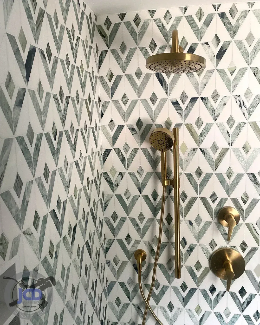 Custom shower plumbing installation with designer fixtures in a high-end bathroom renovation