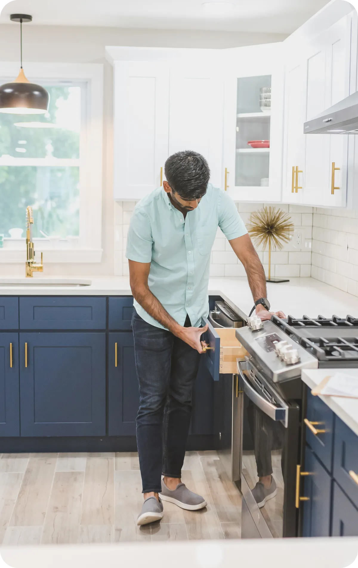 Certified home inspector in Charlotte, NC examining kitchen appliances during buyer’s home inspection | Charlotte Home Inspector Pros