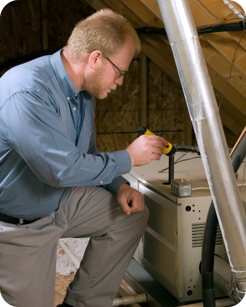 Certified home inspector in Charlotte, NC inspecting HVAC system during home inspection | Charlotte Home Inspector Pros