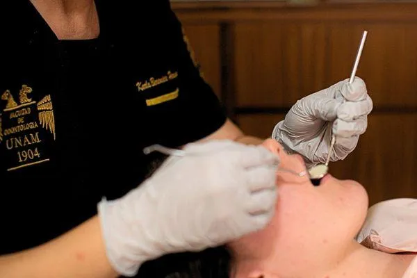 Patient getting teeth inspected by a holistic dentist