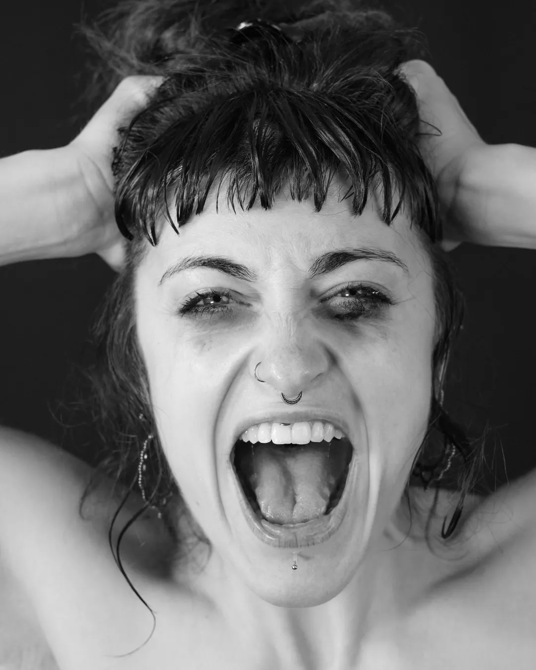 woman in black dress shirt using MacBook