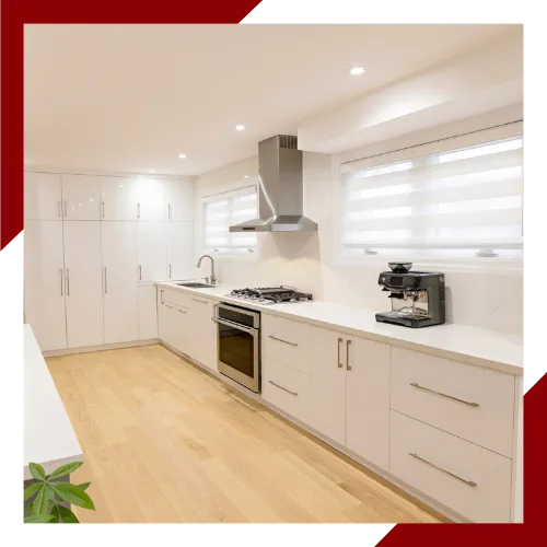 Skilled kitchen contractor installing custom cabinets in a new kitchen space