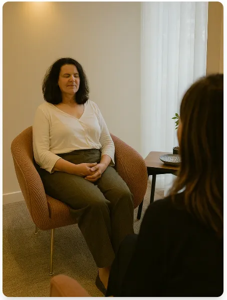 Lady sitting on a hypnotherapy chair