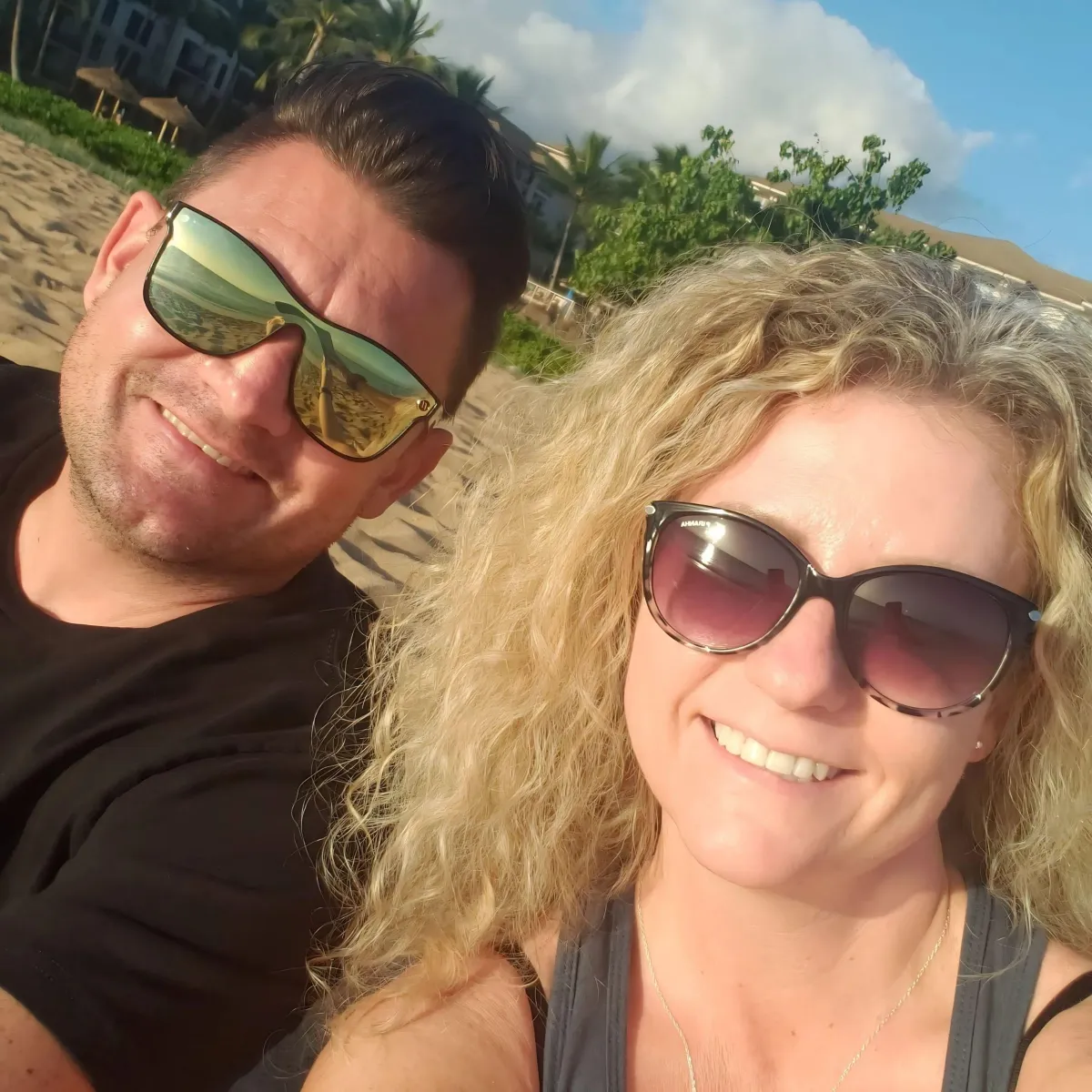 Image of Garrett and Jaime inviting you to connect with The Brand Is Love on social media for updates and support.