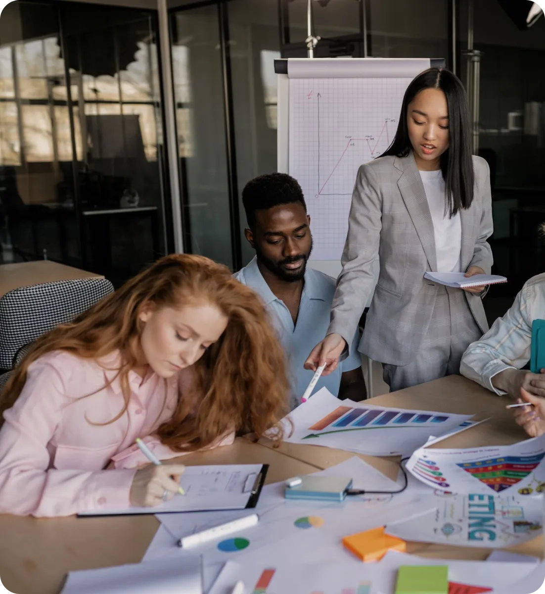 Image of 3 employees talking business