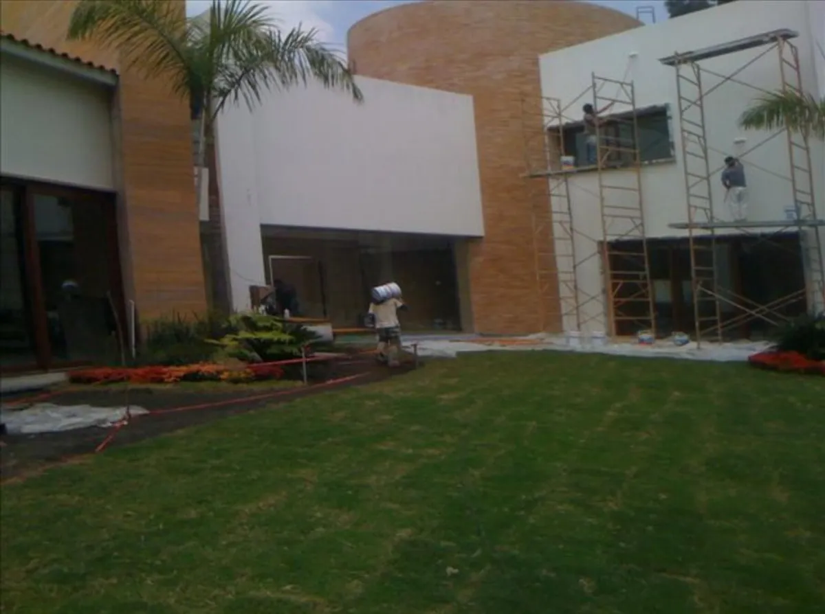 man standing beside train rail