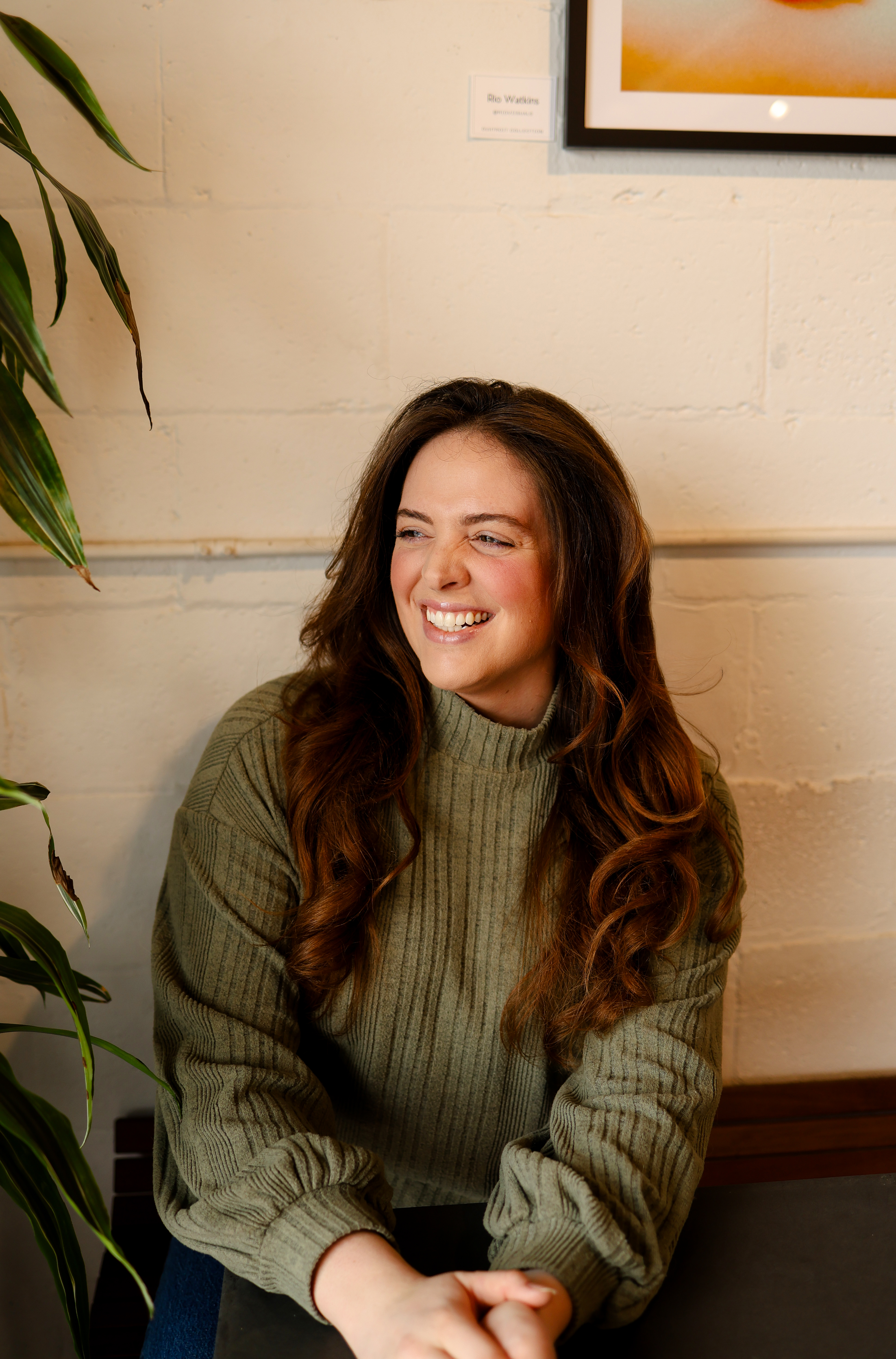 Founder sitting at a desk working on laptop