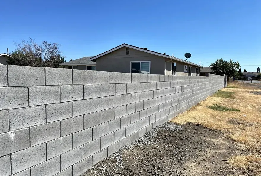 Finished concrete block wall along the perimeter of a residential property in Red Bluff California