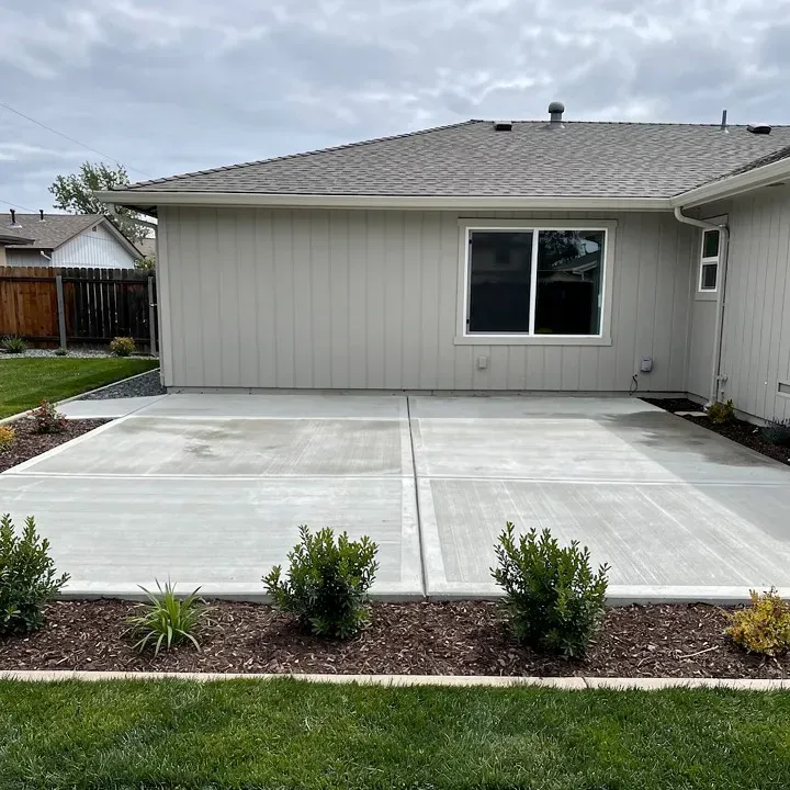 Freshly completed concrete patio installation at a residential property in Marrero Louisiana