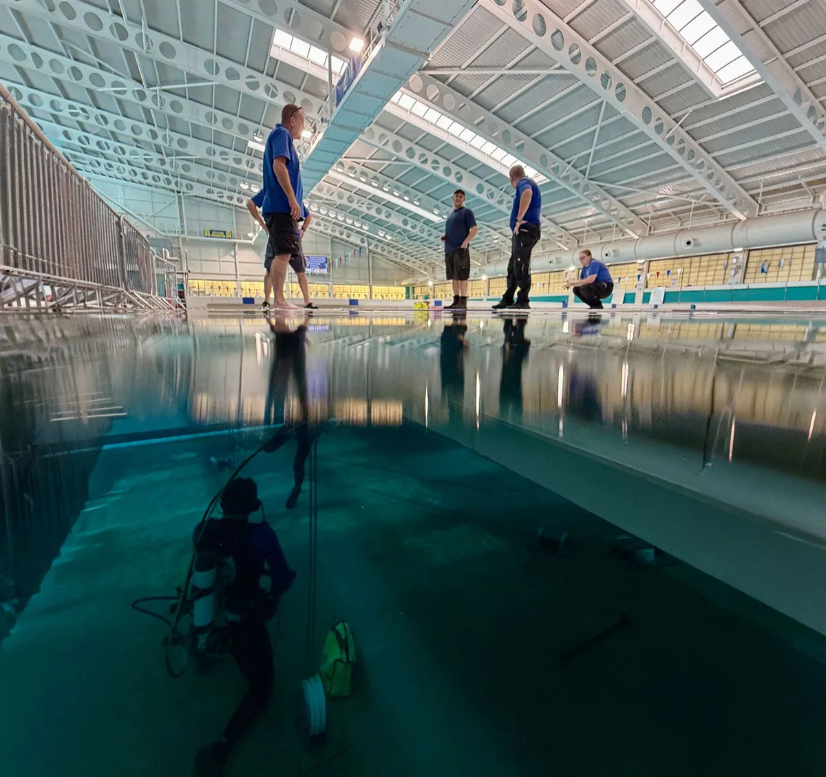 Moveable pool floor raised in an empty commercial swimming pool
