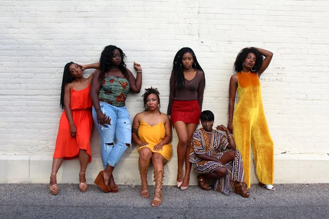  black women wearing colorful outfits