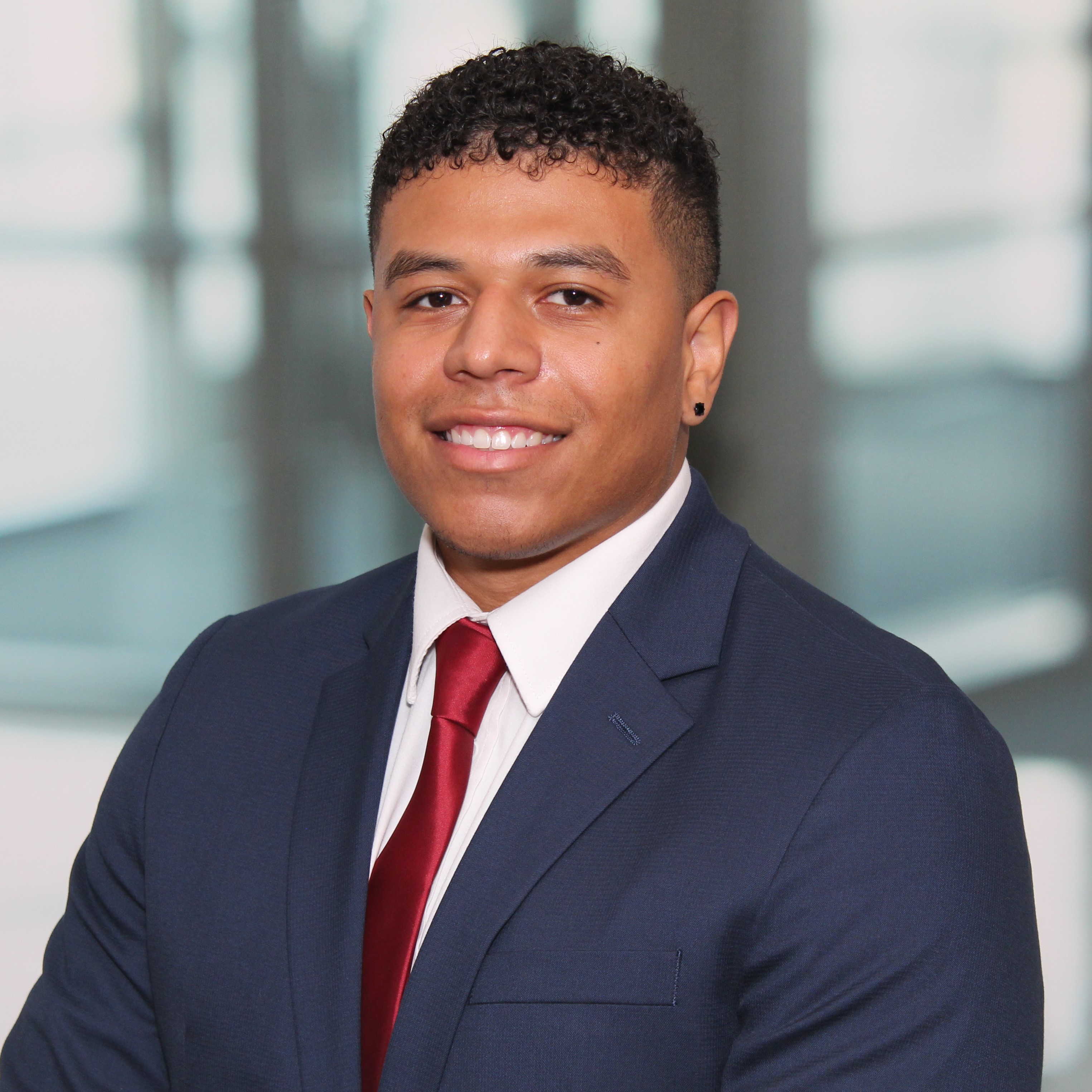 TrueTxClean founder and team standing in front of branded service van in Dallas. The group is diverse, smiling, and wearing matching uniforms. The van features the company logo and city skyline in the background.