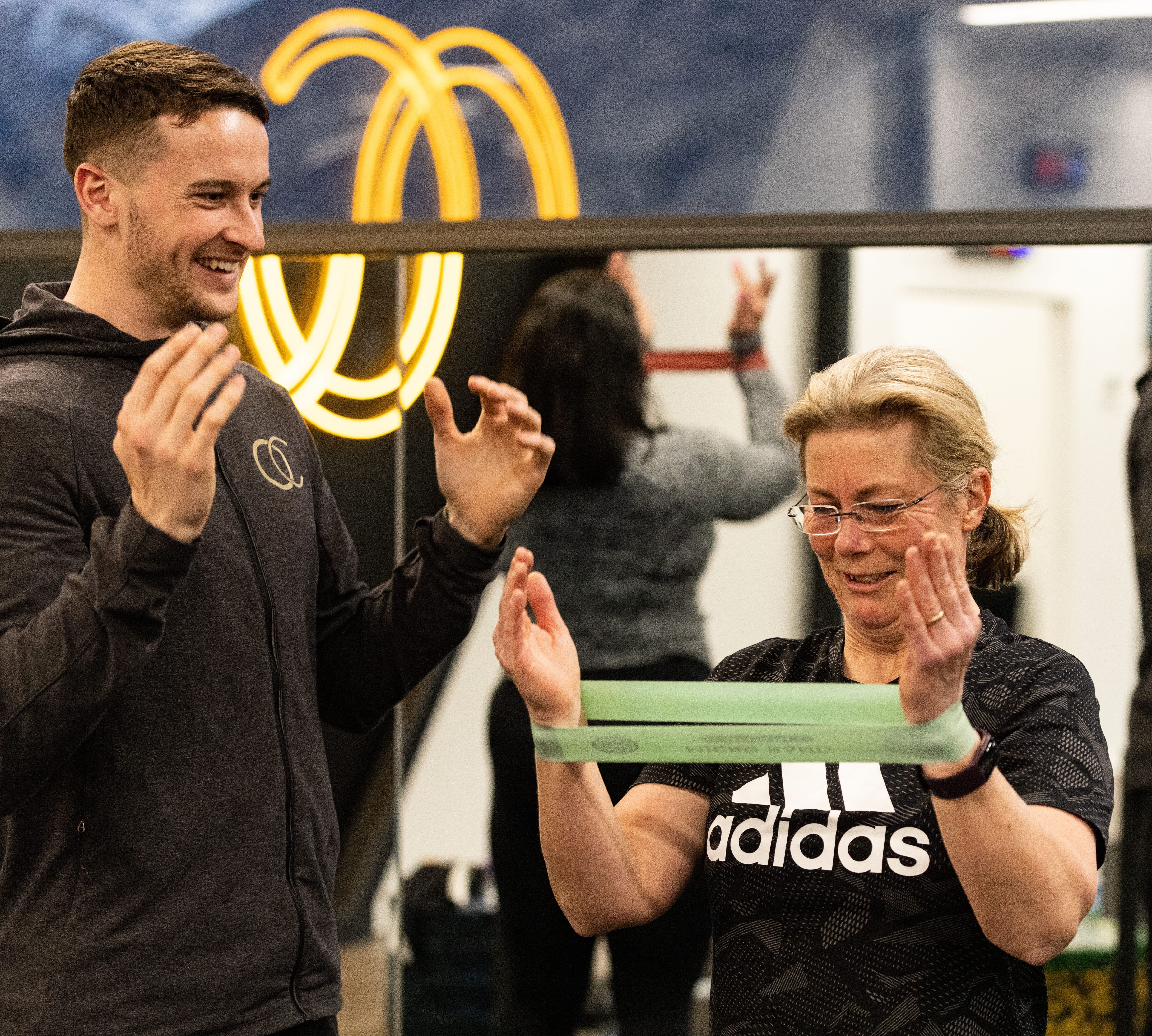 Coach discussing personalised health recommendations with a member following an Evolt 360 body composition scan.