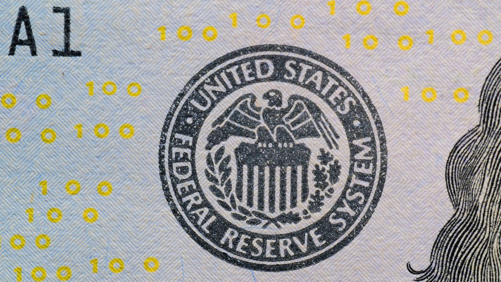 Close-up of the Federal Reserve System seal printed on U.S. currency