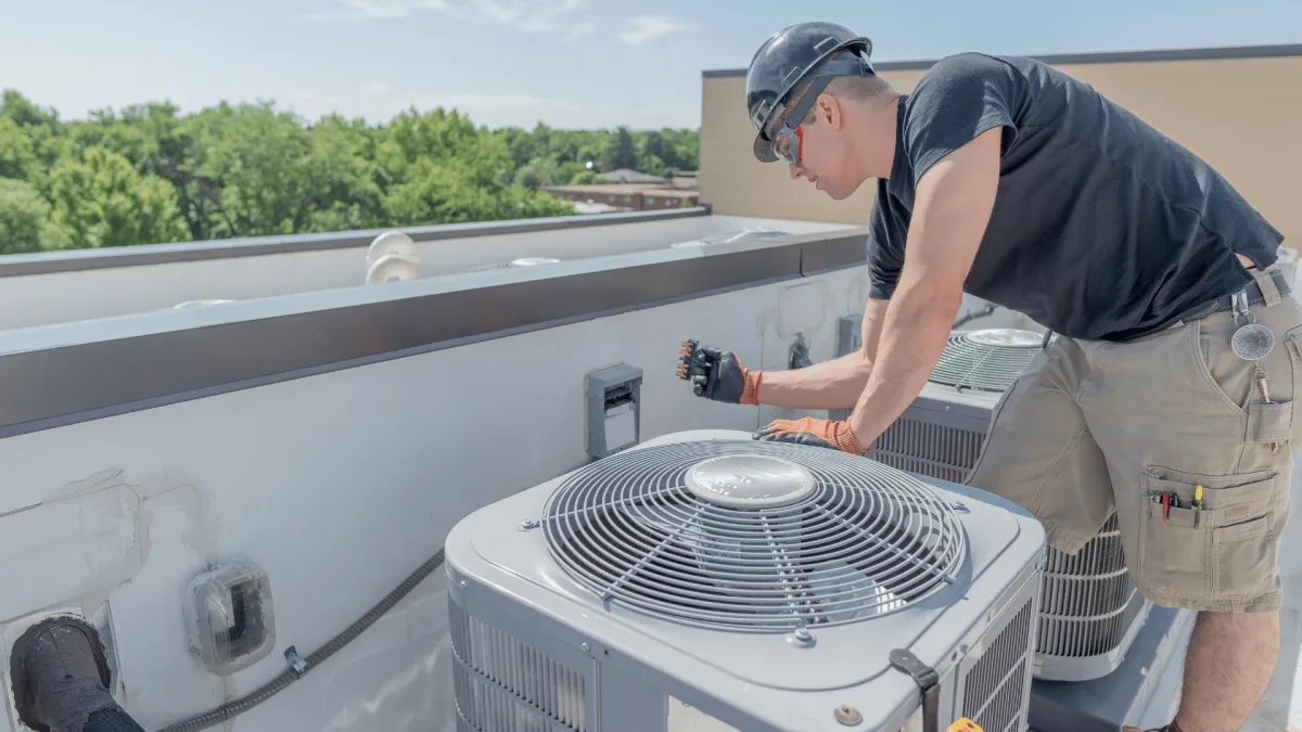 expert doing HVAC maintenance
