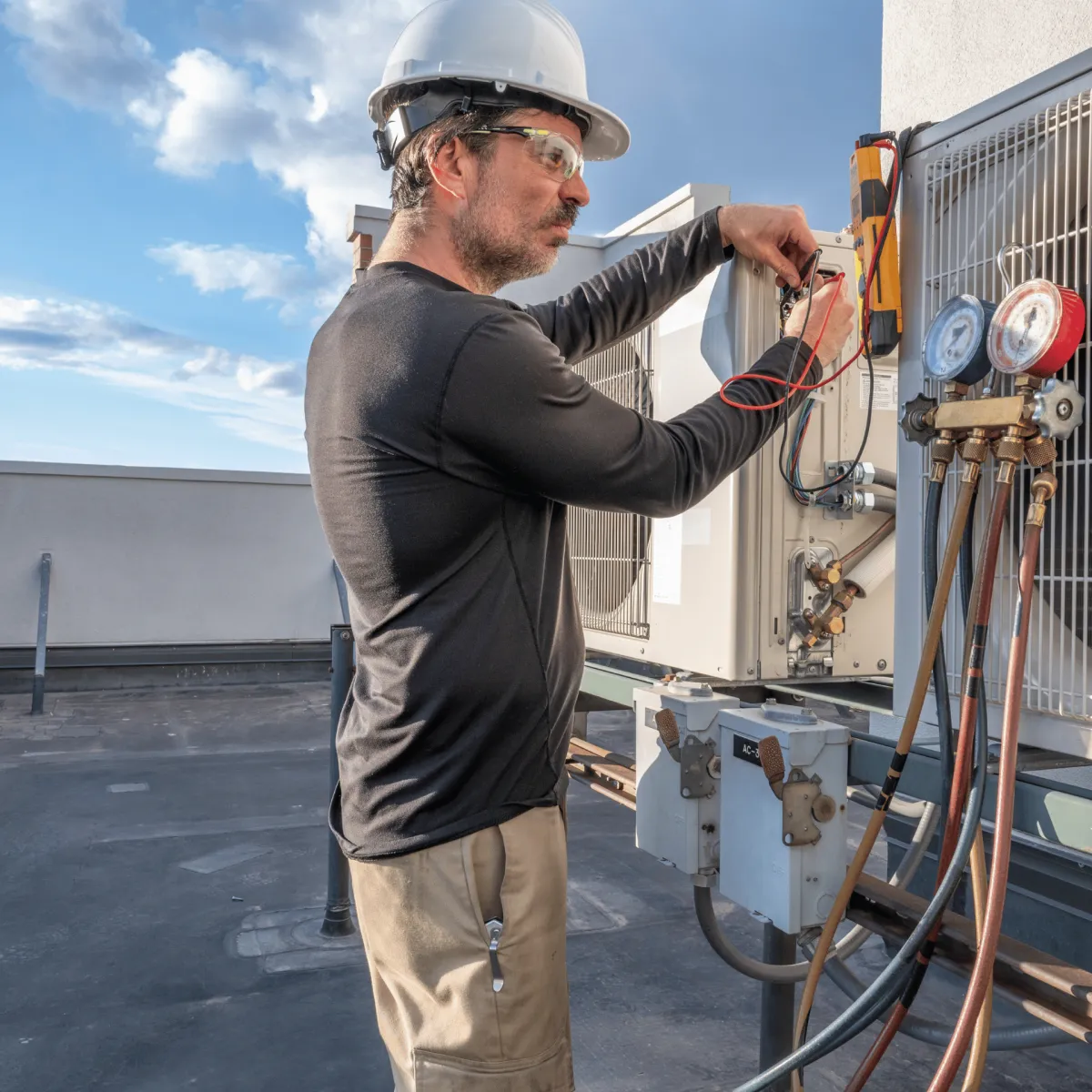 an expert repairing air conditioning unit