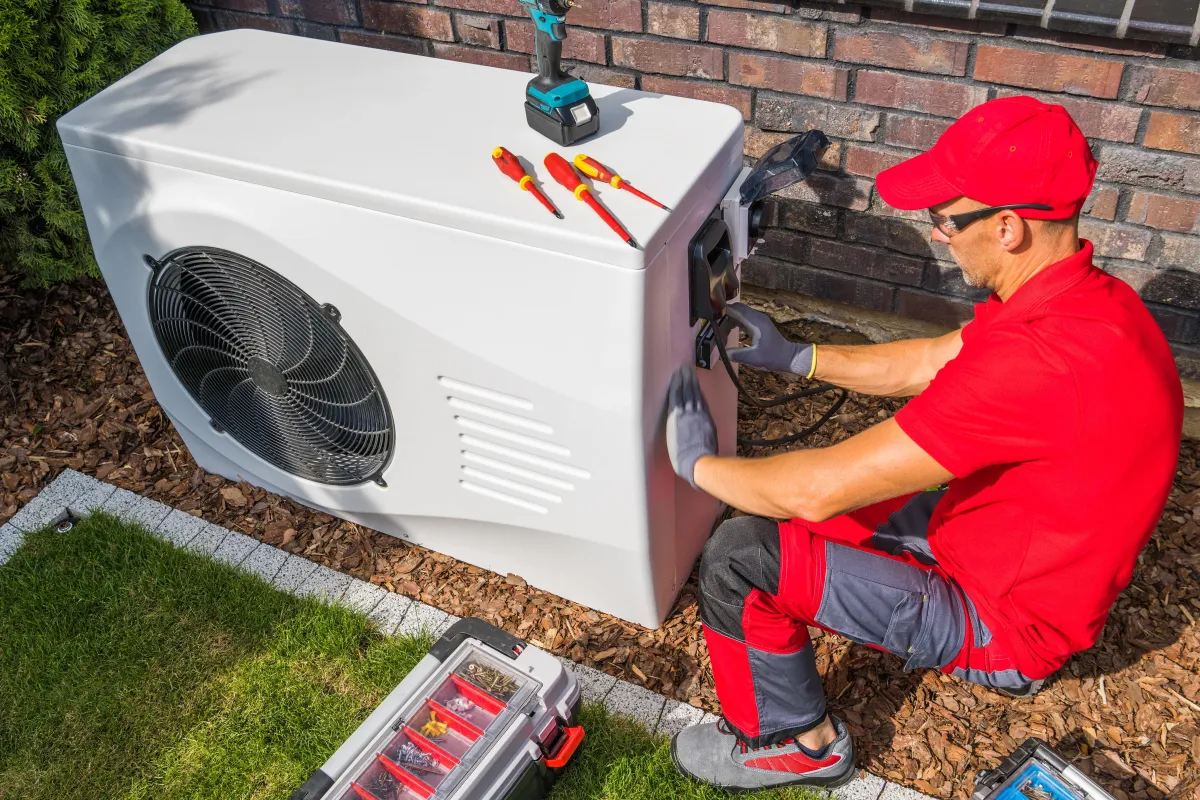 expert repairing heat pump