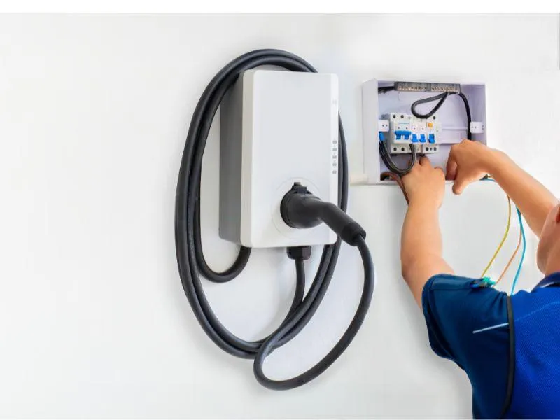 Branch Electric technician wiring a wall connector during EV charger installation for a residential home in Indianapolis, Indiana. Professional EV charger installation in Indianapolis by Branch Electric. Expert service for Tesla and all electric vehicle charging stations at home or work.