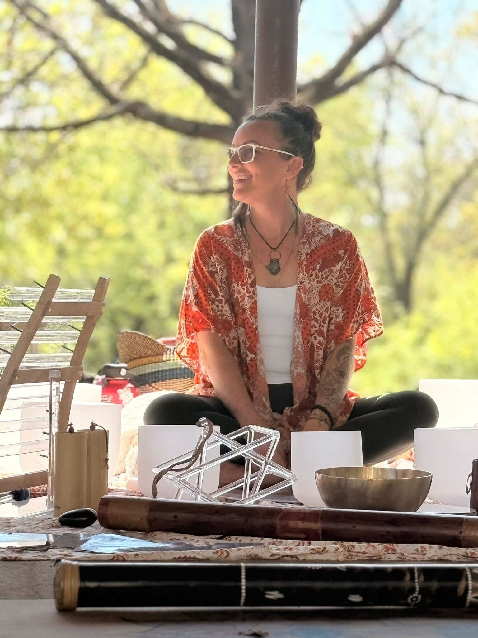 Man exercising on a leg press machine with a female trainer assisting, demonstrating personalized exercise therapy at ZOVA Chiropractic Rehab Center.