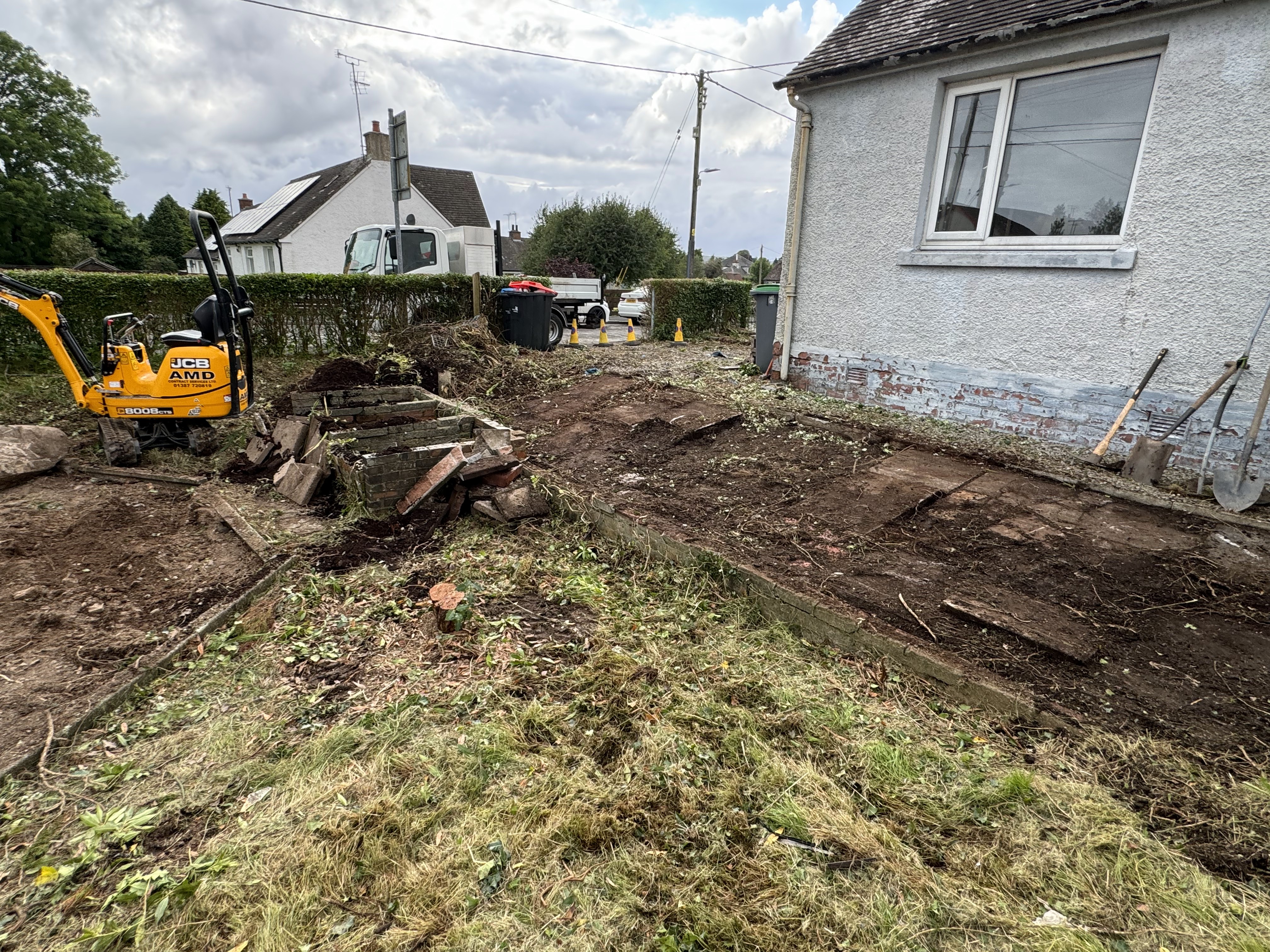 JF Groundworks using compact JCB excavator for garden clearance and ground preparation works
