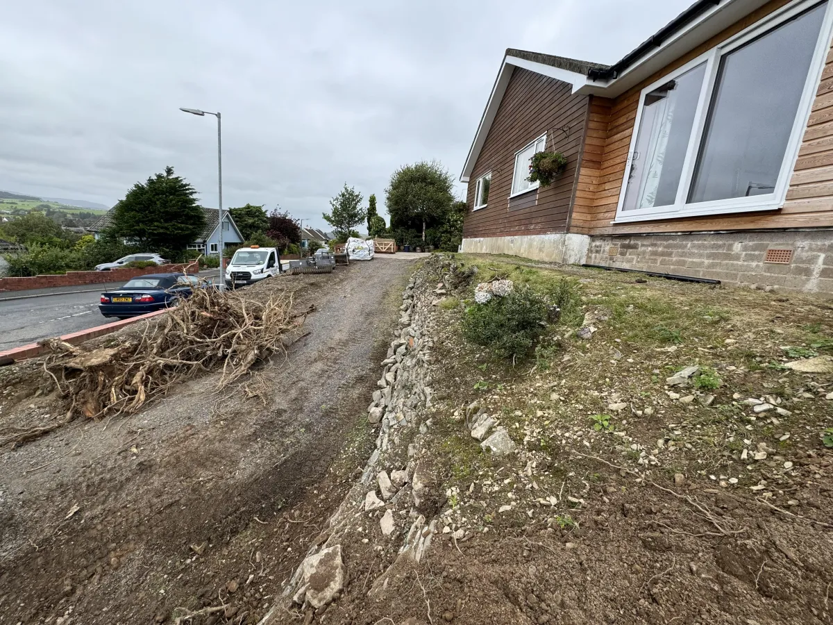 Site before concrete driveway and foundation preparation with ground ready for excavation by JF Groundworks