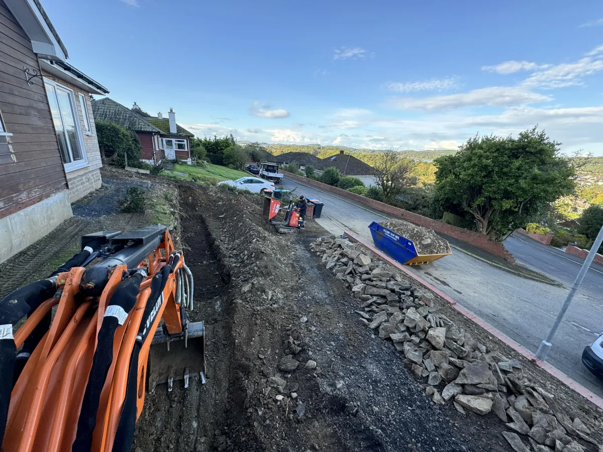 JF Groundworks machinery supporting excavation and ground preparation for concrete driveway and foundation works