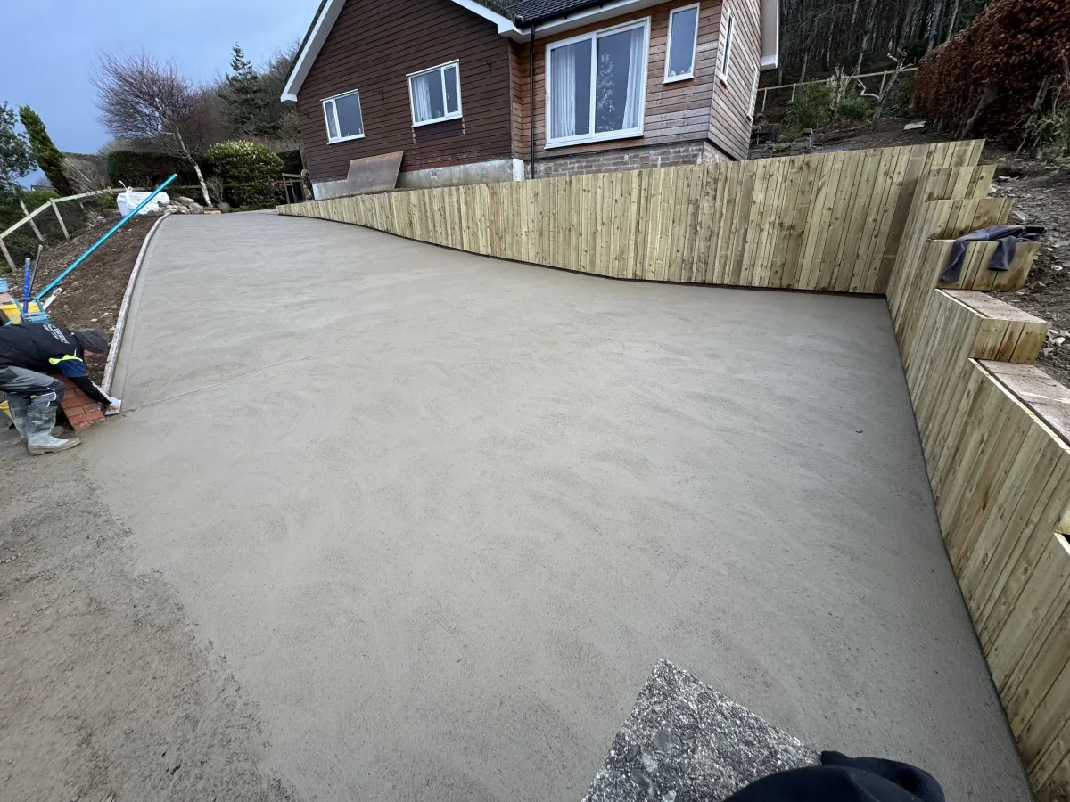 Completed concrete driveway base and foundation area after groundwork support by JF Groundworks and GW Davidson