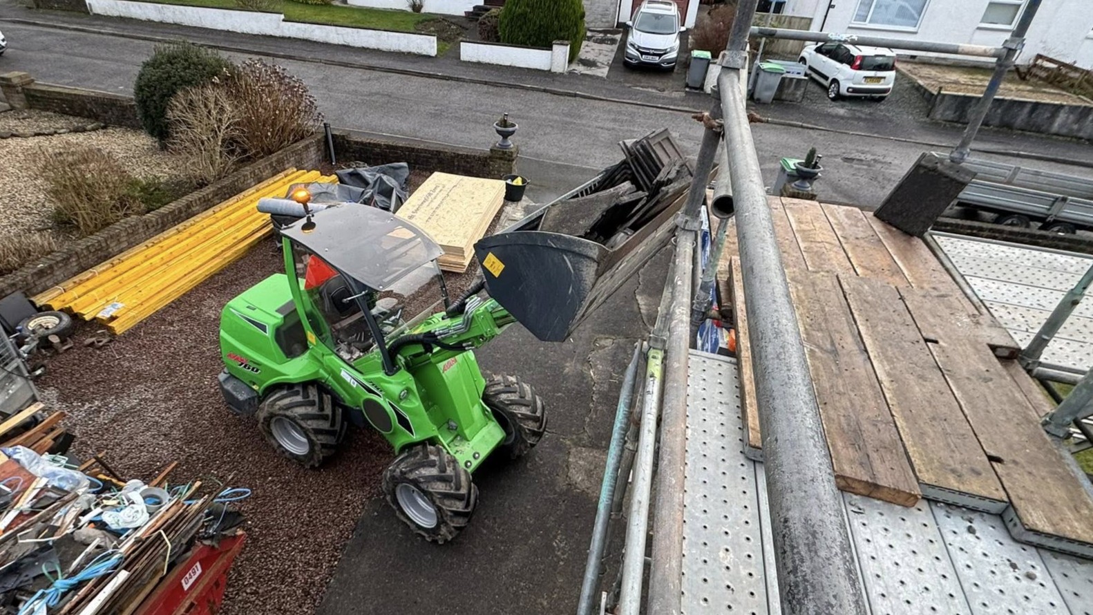 Avant 760i loader assisting a roofing job in Kirkcudbright with material movement and site support by JF Groundworks