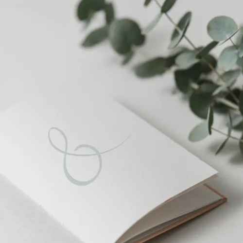 A note book with a large ampersand on the cover