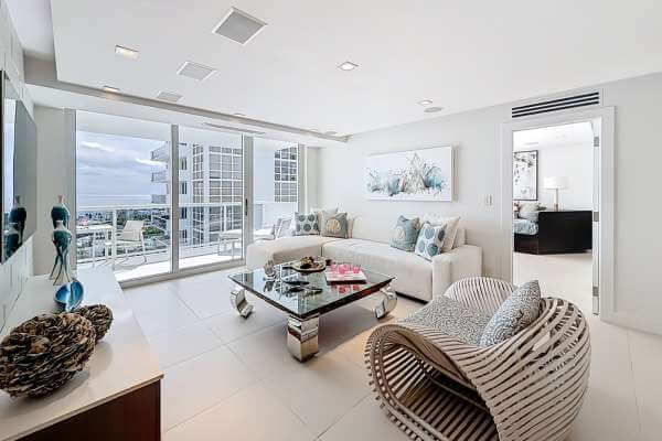 Modern Miami home with SOLD sign in front, blue sky background, elegant styleModern Miami home with SOLD sign in front, blue sky background, elegant style