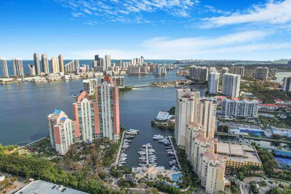 Luxury apartment interior with large windows, ocean view, minimalist decor, Miami style