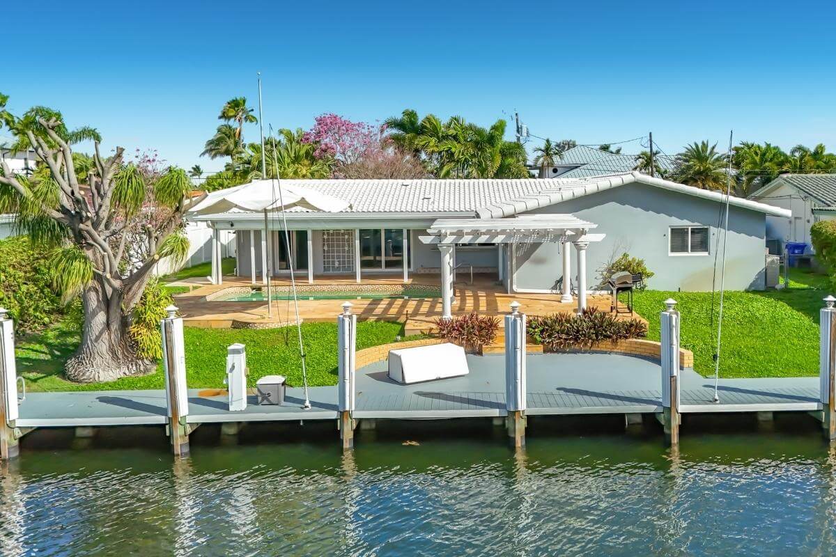 Pompano Beach featuring a private pool, dock, and ocean access
