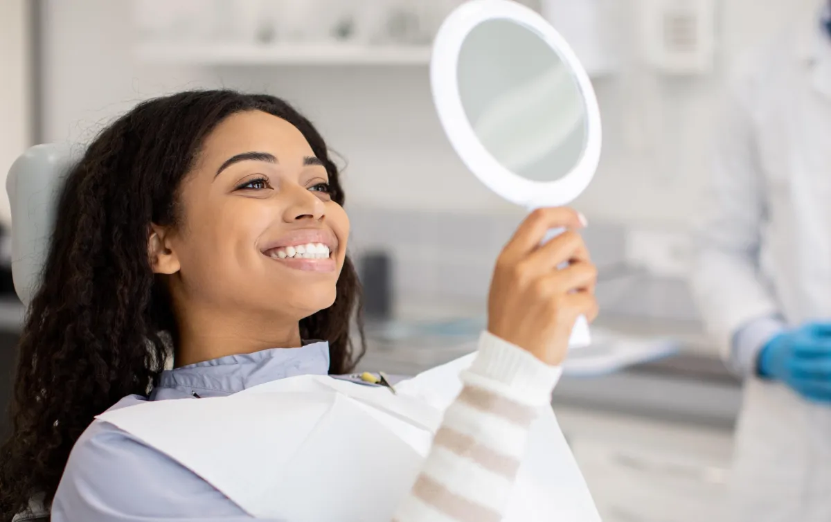 Patient smiling after dental Implant results