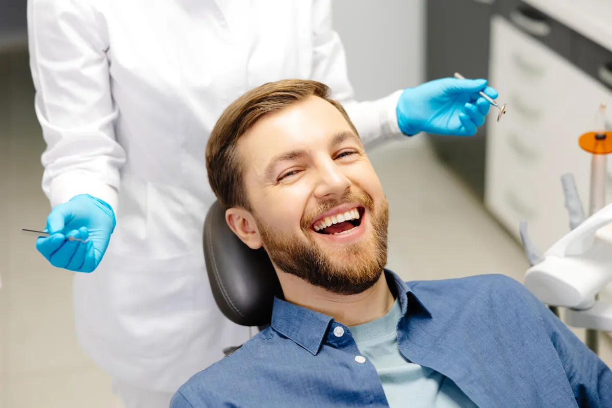 patient smiling after cosmetic dental procedure